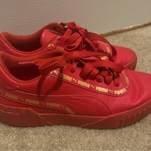 Red and gold puma sneakers size 6.5